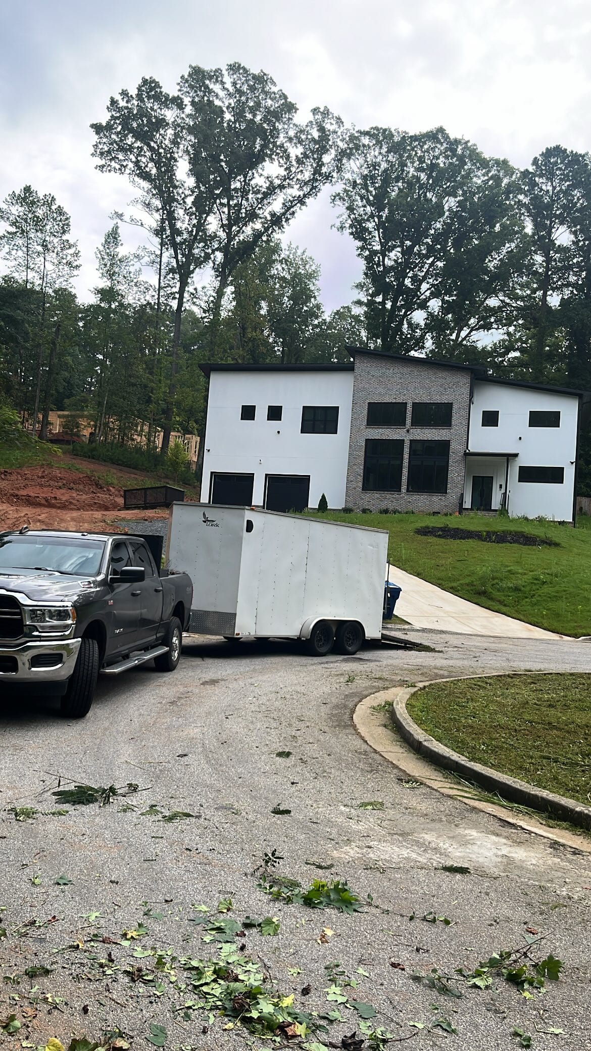 One-story brick house with a driveway and green lawn